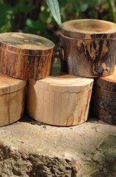 a group of round wooden ring boxes