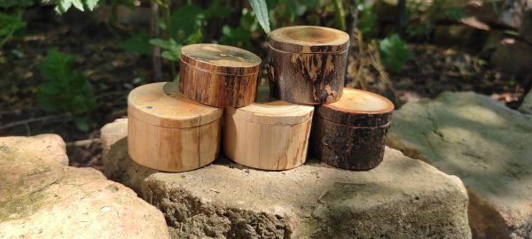 a group of round wooden ring boxes